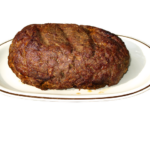 A cooked free-form meatloaf on a plate